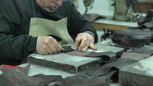 Shoemaker Gluing Leather In Shoe Factory 2