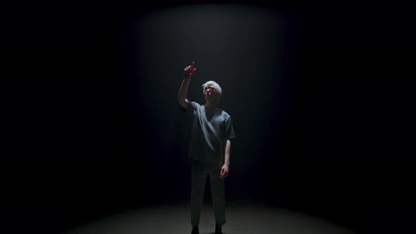 Vr Teenager Touching Air in Dark Room alt