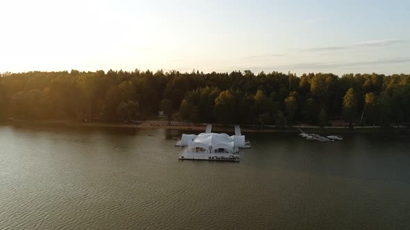The Drone Flies Up to the Pier on Which There is a Large White Marquee in Which Parties and Evening