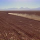 Red SUV Drive Along the Empty Road of the Wasteland - VideoHive Item for Sale