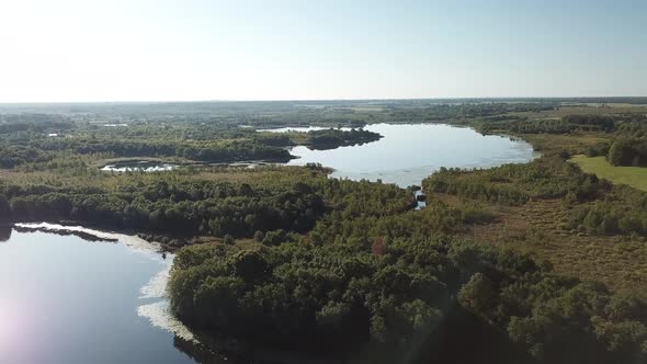 Flight Over Beautiful Lakes Near The Village Of Ostrovno alt