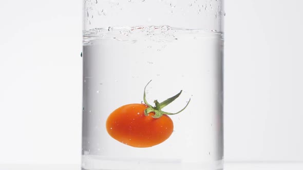 A Falling Tomato in a Pot with Water