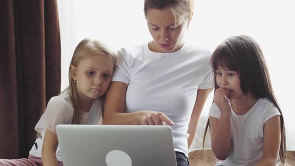 Mom with children doing homework