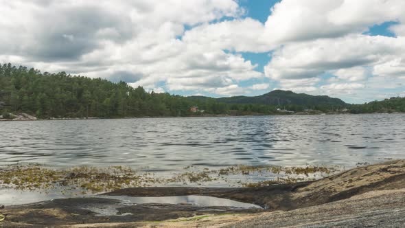 Summer time lapse of rocky Norwegian fjord coastline alt