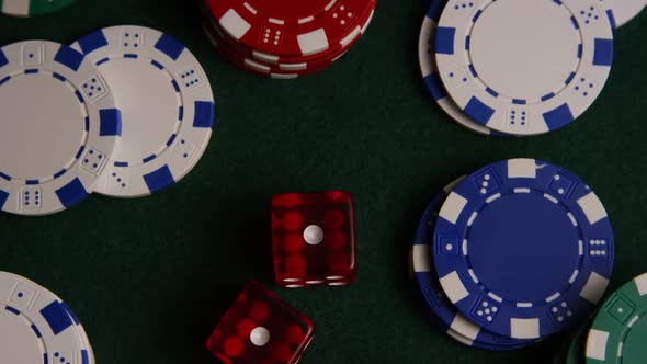 Rotating shot of poker cards and poker chips on a green felt surface - POKER 028 alt
