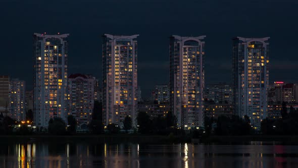 Tall Houses Of A Big City Near The River, Sunset, Time Lapse