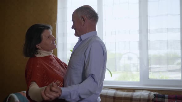 Happy Family, Elderly Lively Couple Middle Aged Woman and Man Relaxing Together Having Fun Dancing alt