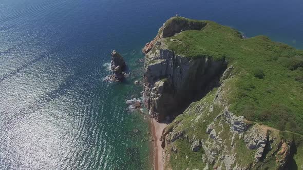 View From a Drone of the Coastline with a Rocky Coast Island of Shkot alt
