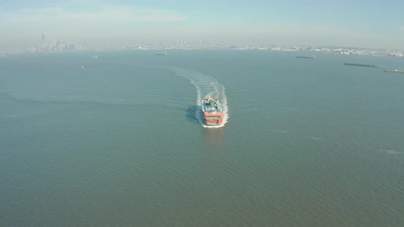 Aerial Drone Shot Tilting Down as Sten Island Ferry Passes Underneath