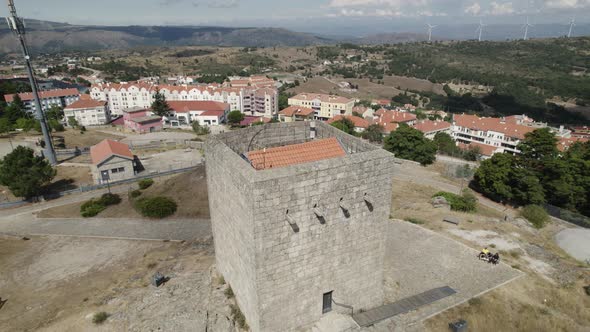 Medieval Castle of Guarda situated on a hill, aerial dolly out reveal