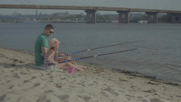 Happy Father and Daughter Fishing Together alt