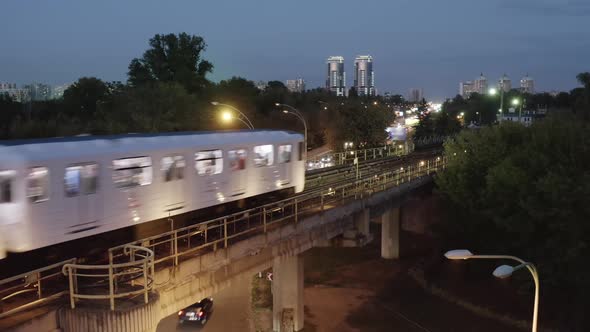 City Skyline with Subway Train passing by