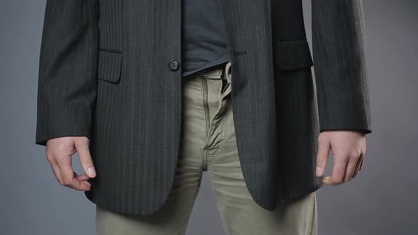 Slim Man Zipping and Unzipping Pants Zipper, Man's Clothes, Close-Up Shot alt