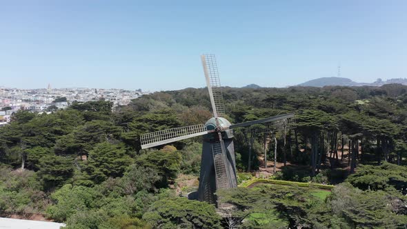 Close-up panning aerial shot of the Dutch Windmill in Golden Gate Park, San Francisco. 4K alt