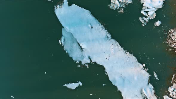 Spring Early Drift on Beautiful River with Broken Off Pieces of Ice Float Down the Stream alt