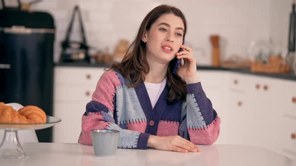 Female Wearing Knitted Sweater Call By Mobile