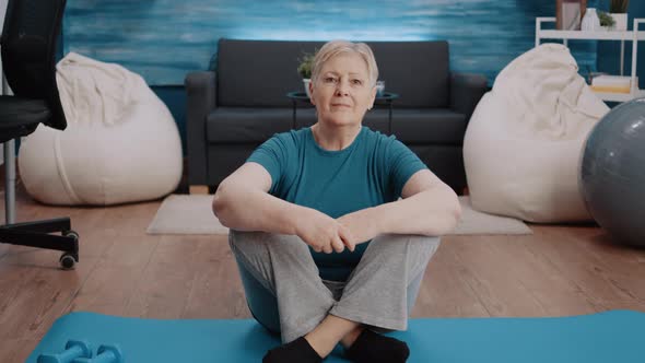 Portrait of Senior Woman Preparing to Workout at Home alt