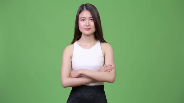 Young Beautiful Asian Businesswoman with Arms Crossed