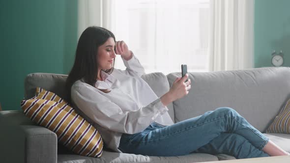 Woman is Communicating Online in Room