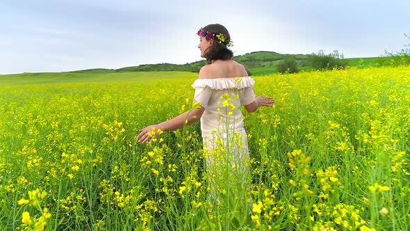 Happy Woman in Rape Field alt