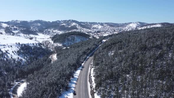 Above the snowy mountains to a snowy city