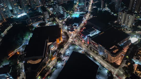 Aerial Hyperlapse view above traffic at a intersection, at night, in Sao Paulo Brasil, America - orb alt