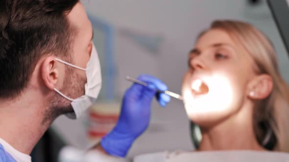 Busy dentist during a very important dental treatment alt