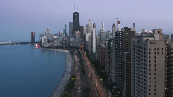 Night Scene Chicago Downtown at Dusk with Purple Blue Sunset Sky Background alt