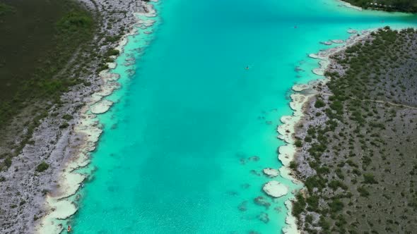 aerial top down view of tropical turquoise blue Lagoon in Bacalar Mexico on sunny day alt