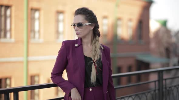 Cropped of Trendy Woman in Purple Jacket and Black Top