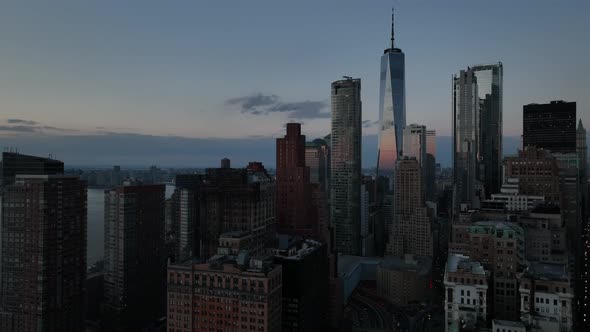 An aerial view of lower Manhattan, NY on a beautiful evening just before sunset. The drone camera, l alt
