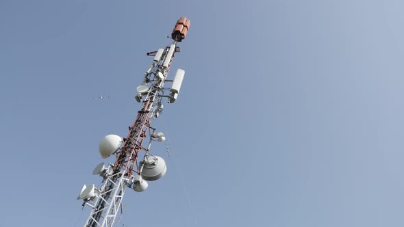 Slow pan antenna system on telecommunication tower 4K 2160p 30fps UHD footage - Base station  for mo alt