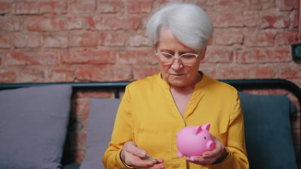 Satisfied Elderly Pensioner Saving Money in His Piggy Bank  Retirement Concept alt