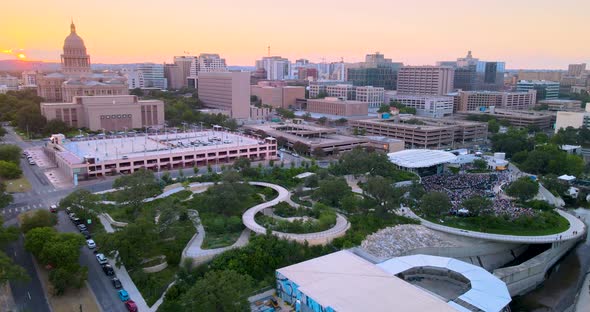 Sunset in Austin, Texas near Capital building and Waterloo Park. Birds eye view from top looking up. alt