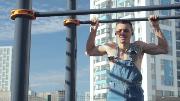 A man exercising on a sports ground