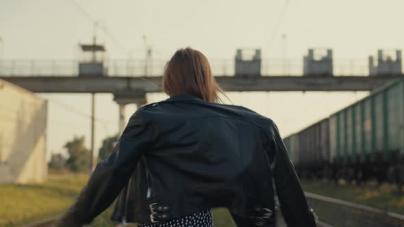 Light Erotic Dance of a Girl in a Sundress and a Leather Jacket