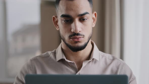 Serious Male Young Hispanic Business Man Investor Freelancer Agent Typing on Computer at Home Office alt
