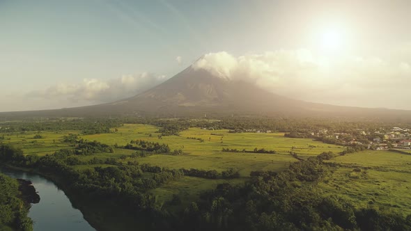 Sun Shine Over Mayon Volcano Erupts Aerial, River at Green Grass Hillside, Tropic Forest at Legazpi alt