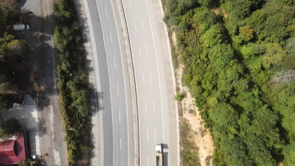 Aerial View of the Two Sides of a Highway Surrounded alt