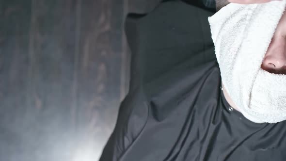 Barber Using Hot Towel alt