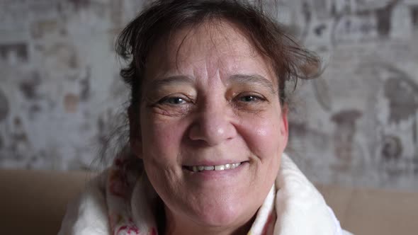 Happy Mature Middle Aged Single Woman Looking at Camera Posing at Home for Video Portrait Smiling