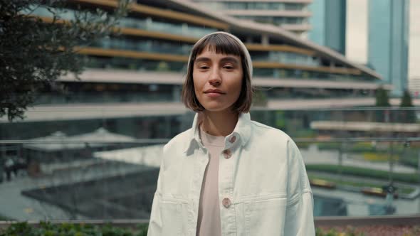 Positive Brunette Enjoying Shopping Time at Mall alt