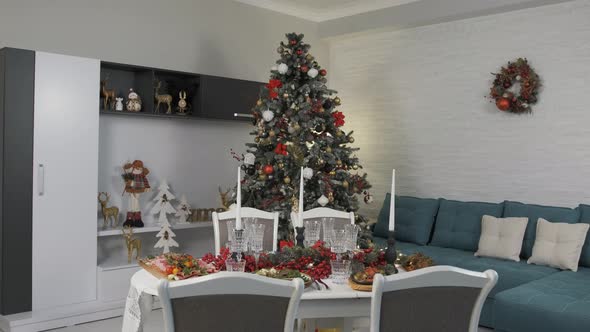 Christmas Table Full with Delicious Dishes in a Beautifully Arranged Living Room alt