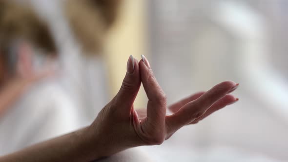 Closeup of Senior Women Hand Practice Yoga