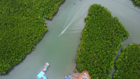 Aerial view of Thai traditional longtail fishing boats at the pier in Phang Nga Bay in the Andaman S alt