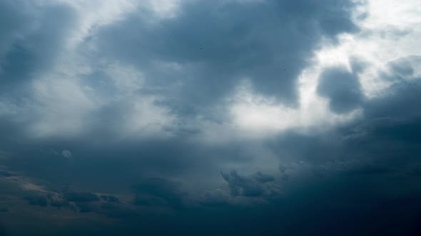 Timelapse Gray Rainy Clouds Float Across the Dark Sky on a Cloudy Day alt