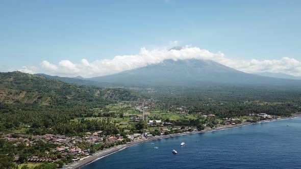 Village and Sea on the Background of Volcano Agung Bali Island