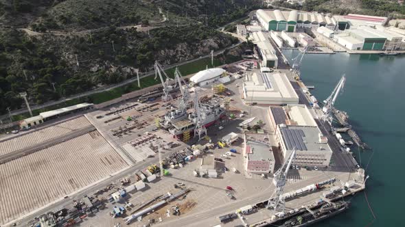 Cranes and warehouse facilities at port in Cartagena, Spain. Logistic hub. Aerial view