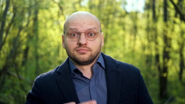 A Nerd Man Adjusts His Glasses Rolls His Eyes and Looks Around Suspiciously alt