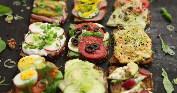 Top View of Different Decorated Sandwiches As Appetizer alt
